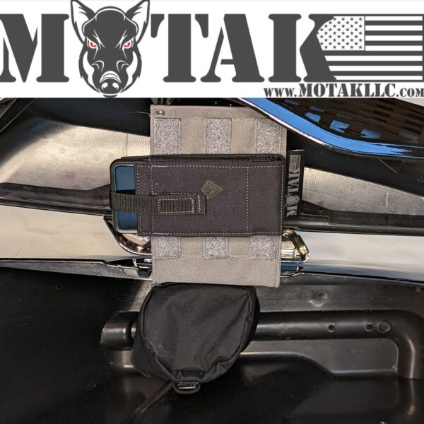Grey saddlebag organizer panel with a black pouch, securely attached inside a motorcycle saddlebag. The Motak logo and website URL are displayed at the top.