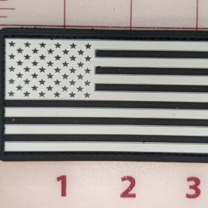 Black and white American flag patch with a rectangular border.